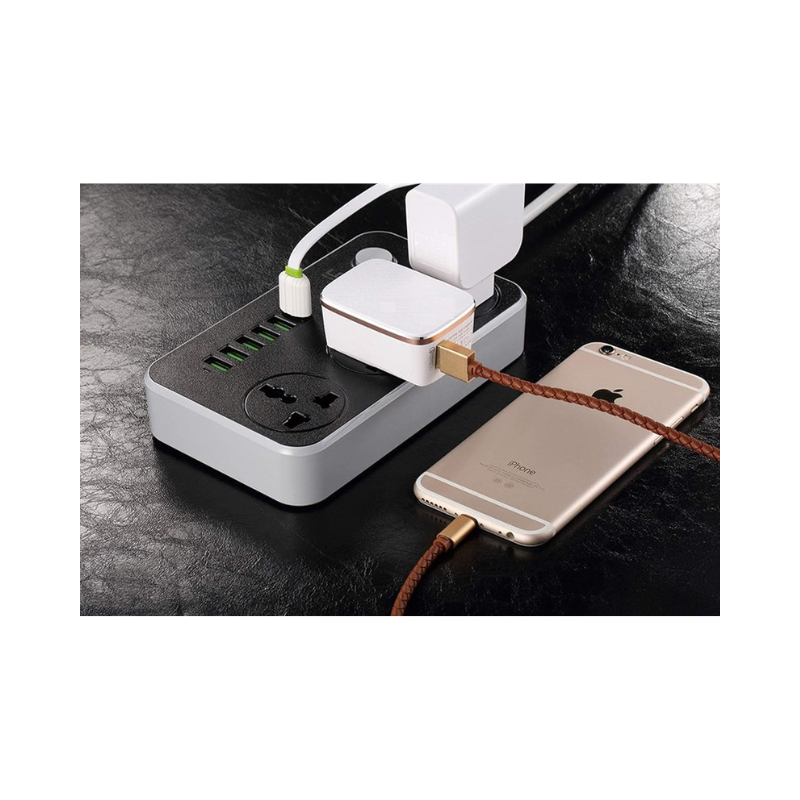 Foji extension,Power strip with multiple outlets and devices on a dark surface